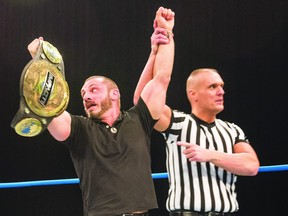 Austin Aries is presented with the championship belt after besting Eli Drake in a between bout challenge in February.