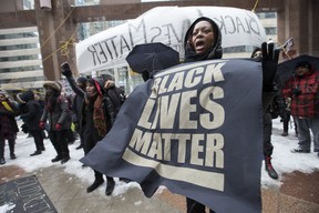 Black Lives Matter protestors demonstrate outside Toronto Police Headquarters on Monday April 4, 2016. (Craig Robertson/Toronto Sun/Postmedia Network)
