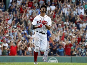 Boston Red Sox shortstop Xander Bogaerts shouts while rounding the bases after hitting a grand slam against the Toronto Blue Jays Saturday, July 14, 2018, in Boston. (AP Photo/Winslow Townson)