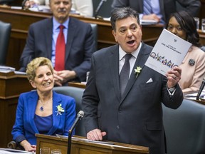 Ontario Finance Minister Charles Sousa delivers the provincial budget in March 2018 at the Ontario Legislature, while Ontario Premier Kathleen Wynne looks on. (Ernest Doroszuk/Toronto Sun)