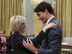 Carla Qualtrough is hugged by Prime Minister Justin Trudeau after being sworn in as Minister of Public Services and Procurement and Accessibility, during a swearing in ceremony at Rideau Hall in Ottawa on Wednesday, July 18, 2018.
