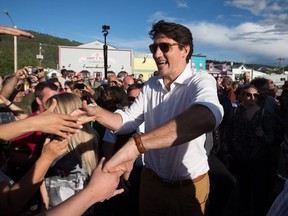 Prime Minister Justin Trudeau greets people at a Canada Day barbecue in Dawson City, Yukon, on Sunday, July 1, 2018. THE CANADIAN PRESS/Darryl Dyck ORG XMIT: VCRD235