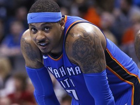 In this Feb. 13, 2018, file photo, Oklahoma City Thunder forward Carmelo Anthony pauses during a game against the Cleveland Cavaliers in Oklahoma City. (AP Photo/Sue Ogrocki, File)