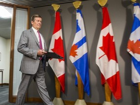 Toronto Mayor John Tory arrives to address media about community investments to combat gun and gang violence during a press conference at his office at city hall in Toronto, Ont. on Wednesday July 18, 2018. (Ernest Doroszuk/Toronto Sun)