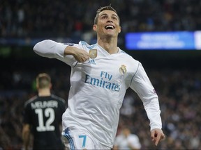 Real Madrid's Cristiano Ronaldo celebrates his side's 2nd goal during a Champions League match against Paris Saint Germain at the Santiago Bernabeu stadium in Madrid, Spain on Feb. 14, 2018.