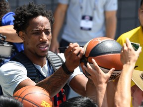 DeMar DeRozan signs autographs after a practice session at the USA Basketball minicamp in Las Vegas. DeRozan, who was recently traded from the Raptors to the San Antonio Spurs, says he doesn’t intend to maintain a relationship with Raps president Masai Ujiri, who orchestrated the surprise deal. (GETTY IMAGES)