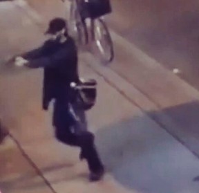 A man with a gun fires on the Danforth late Sunday, July 22, 2018. (Video screengrab)