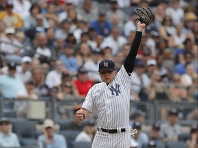 Brandon Drury, shown leaping at third base during his time with the Yankees, is expected to receive ample playing time with the Blue Jays. (AP/PHOTO)