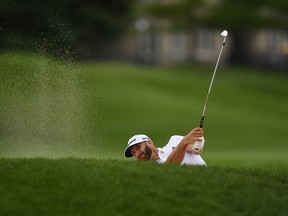 Dustin Johnson plays his shot on the 18th hole during the third round at the RBC Canadian Open at Glen Abbey Golf Club on July 28, 2018 in Oakville. (GETTY IMAGES)