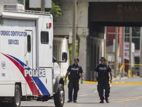 Toronto police at the scene of a homicide along Eastern Ave., east of Broadview Ave., in Toronto. Ont. on Saturday July 21, 2018. Ernest Doroszuk/Toronto Sun/Postmedia