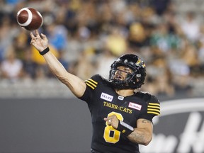 Hamilton Tiger-Cats quarterback Jeremiah Masoli throws the ball during second half CFL football action against the Saskatchewan Roughriders, in Hamilton, Ont., Thursday July 19, 2018. THE CANADIAN PRESS/Mark Blinch