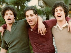 This undated photo provided by film studio NEON shows Eddy Galland, from left, David Kellman and Bobby Shafran, three brothers who learned at age 19 that they had been separated at birth. The story of the three identical triplets is the subject of the film "Three Identical Strangers," which opens in theaters on July 13. The film shows not only their joyous first meeting, but also the dark backstory that led to their separation. (Family Photo/Courtesy of film studio NEON via AP)
