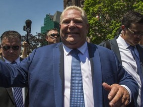Newly sworn in Ontario Premier Doug Ford greets people outside of Queen's Park in Toronto, Ont. on Friday June 29, 2018. Ernest Doroszuk/Toronto Sun