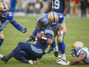 QB James Franklin is downed in the Argos’ Saturday loss to Winnipeg at BMO Field. They face the Bombers on the road on Friday night. (The Canadian Press)