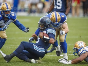 QB James Franklin is downed in the Argos’ Saturday loss to Winnipeg at BMO Field. They face the Bombers on the road on Friday night. (The Canadian Press)