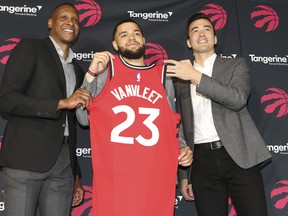 Raptors’ Fred VanVleet (centre) along with president Masai Ujiri (left) and general manager Bobby Webster were all smiles yesterday after announcing the two-year deal for the point guard.  Jack Boland/Toronto Sun