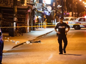 Police investigate after four people were shot in Kensington Market on Canada Day. One man later died becoming the city's 51st murder victim of 2018. (VICTOR BIRO PHOTO)