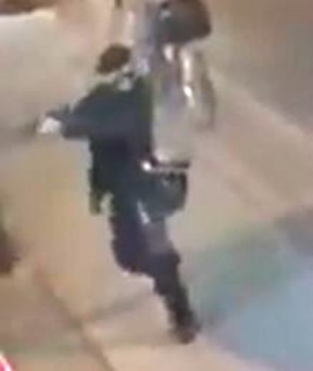 Faisal Hussain, 29, fires a gun on the Danforth late Sunday, July 22, 2018. (Video screengrab)