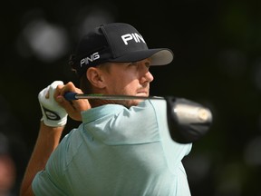 Canadian Mackenzie Hughes plays his shot from the first tee during the third round of the Canadian Open at Glen Abbey Golf Club in Oakville on Saturday. (GETTY IMAGES)