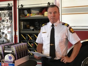 Pickering Fire Chief John Hagg speaks about receiving  donations of smoke and carbon monoxide alarms. (KEVIN CONNOR, Toronto Sun)