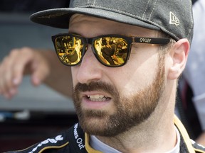 Canadian James Hinchcliffe watches as his mechanics prepare his car for the second practice session ahead of the Honda Indy Toronto on Friday July 13, 2018. (THE CANADIAN PRESS/Frank Gunn)