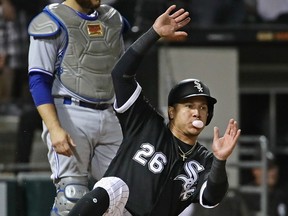 Avisail Garcia  of the Chicago White Sox blows a bubble as he slides in to score a run in the 8th inning against the Toronto Blue Jays at Guaranteed Rate Field in Chicago, last night.  (Getty Images)