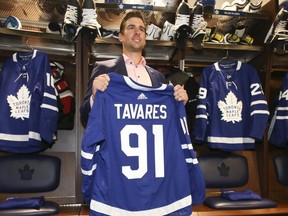 Toronto Maple Leafs John Tavares stands at his stall in the locker room with his new Maple Leafs jersey on Sunday July 1, 2018. Jack Boland/Toronto Sun