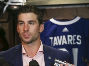 Toronto Maple Leafs John Tavares speaks to the media at his locker after signing on for a seven-year $77-million contract on Sunday, July 1, 2018. Jack Boland/Toronto Sun