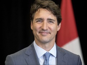 Prime Minister Justin Trudeau attends a meeting with Frank Scarpitti, Mayor of Markham, Ont., during an event on Friday, July 20, 2018.