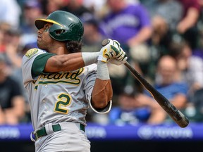 Khris Davis of the Oakland Athletics watches the flight of a seventh inning solo home run against the Colorado Rockies at Coors Field on July 29, 2018.  (DUSTIN BRADFORD/Getty Images)