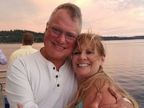 Larry and Lori Isenberg in happier times. He was murdered and cops believe Lori -- now on the run -- and her daughters had something to do with it.