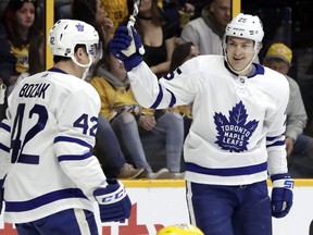 Tyler Bozak, left, and James van Riemsdyk  celebrate a goal against the Nashville Predators on March 22, 2018. (Mark Humphrey/AP)