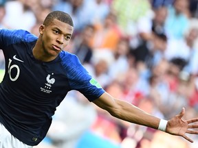 France's forward Kylian Mbappe celebrates after scoring during the World Cup. Could he be the world's greatest player? (GETTY IMAGES)