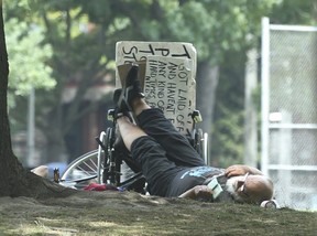 Some of the denizens and elements in Moss Park. (Jack Boland/Toronto Sun)