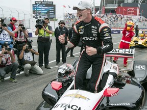 Pole winner Josef Newgarden celebrates after posting the fastest qualifying time for the Toronto Indy on Saturday, July 14, 2018. (THE CANADIAN PRESS/Frank Gunn)