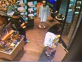 Security camera image of man and woman wanted in a Toronto Police theft investigation.
