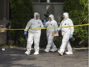 Halton Regional Police Forensic Identification officers at the scene of a homicide in the area of Rebecca St., east of Dorval Dr. in Oakville, Ont. on Saturday July 14, 2018. Ernest Doroszuk/Toronto Sun/Postmedia