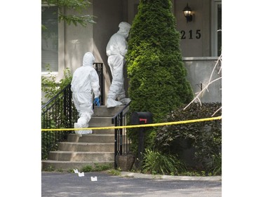 Halton Regional Police Forensic Identification officers at the scene of a homicide in the area of Rebecca St., east of Dorval Dr. in Oakville, Ont. on Saturday July 14, 2018. Ernest Doroszuk/Toronto Sun/Postmedia