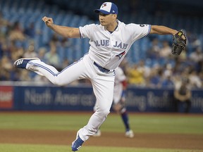 Toronto Blue Jays pitcher Seunghwan Oh throws against the Minnesota Twins in Toronto on Tuesday July 24, 2018. (THE CANADIAN PRESS/Fred Thornhill)
