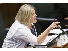 NDP Leader Andrea Horwath exchanges words with Ontario Premier Doug Ford during Question Period at Queen's Park, in Toronto on Tuesday, July 31, 2018. (Chris Young/The Canadian Press)