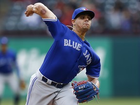 In this April 8, 2018, file photo, Toronto Blue Jays pitcher Roberto Osuna throws during a game in Arlington, Texas. (AP Photo/Jim Cowsert, File)