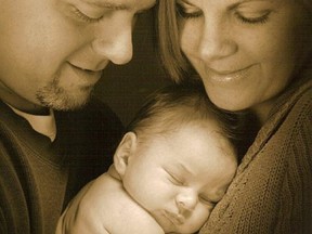 Toronto Police Sgt. Ryan Russell is seen with his wife Christine and their baby in a photo taken from Facebook on Wednesday, January 12, 2011.