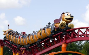 Guests ride the Slinky Dog Dash coaster at Toy Story Land in Disney’s Hollywood Studios at Walt Disney World in Lake Buena Vista, Fla. (AP Photo/John Raoux