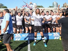 Members of the Toronto Wolfpack rugby team celebrate as they receive the Betfred Championship Leaders’ Shield on July 7, 2018 at Lamport Stadium in Toronto. (TORONTO WOLFPACK PHOTO)