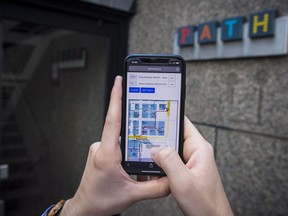 A website which maps out the PATH system is displayed on a cellphone in Toronto on Monday, July 9, 2018.