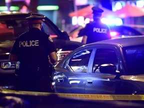 Police work at the scene of a mass casualty incident in Toronto on Sunday, July 22, 2018.