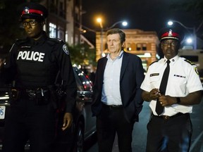 Toronto Mayor John Tory and Toronto Police Chief Mark Saunders at the scene of a mass shooting in Toronto on Sunday, July 22, 2018. (THE CANADIAN PRESS/Christopher Katsarov )