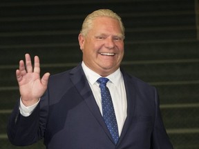 Ontario Premier Doug Ford prepares to greet Prime Minister Justin Trudeau in Toronto, Ont. on Thursday July 5, 2018. Stan Behal/Toronto Sun