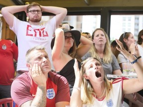 English fans react at Scallywags Restaurant in Toronto after Croatia wins 2- 1 in the Semi-finals at on Wednesday July 11, 2018. (Veronica Henri/Toronto Sun)