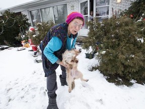Renata Ford’s mother comes out on the front lawn at the late Rob Ford’s home to get the family dog on Thursday December 29, 2016. (Craig Robertson/Toronto Sun)